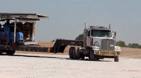 Drilling Rig Being Moved in on Trucks 1 動画素材 42362761