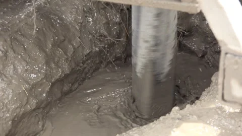 Drilling rig bores an artesian well - Rotary Drilling and Water Extraction Stock Footage 339819064