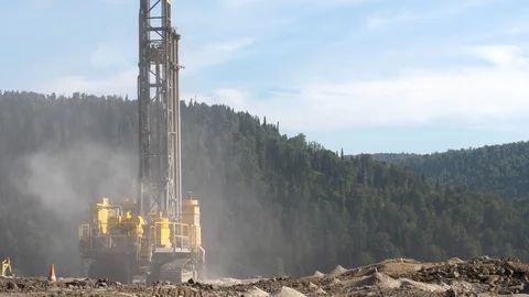 Drilling rig in the coal open pit. Drilling holes for explosives in the quarry Stock Footage 94601415