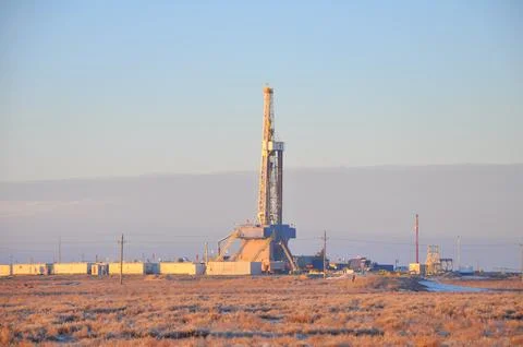 The drilling rig during sunset Stock Photos