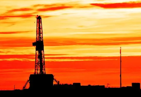 The drilling rig during sunset Stock Photos