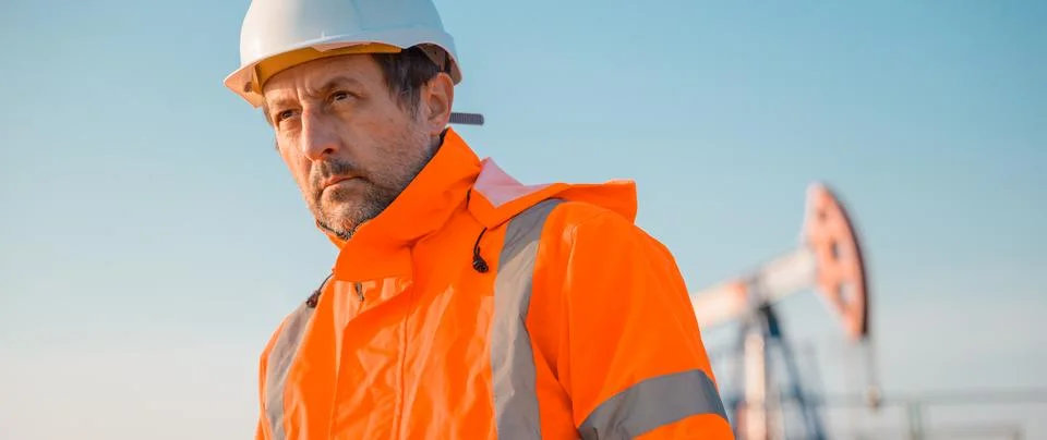 Drilling rig engineer supervising the process of oil and gas extraction, mo.. Stock Photos