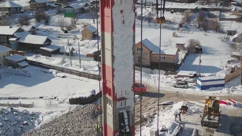 A drilling rig with an excavator working on winter background Stock Footage 169323857