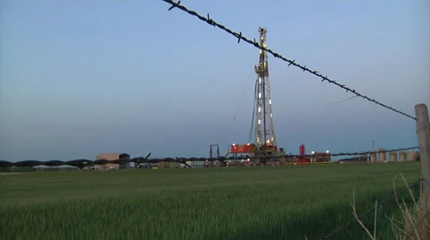 Drilling Rig in Green Wheat w Fence Video stock 38604060