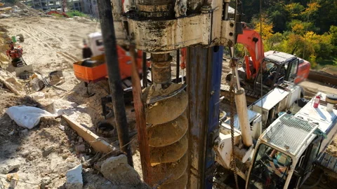 Drilling rig machine operates at a construction site to install bored piles. 스톡 동영상 347978517