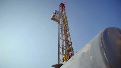 Drilling rig in operation, drilling a well, close-up, slow motion, ukraine flag Stock Footage 142494767