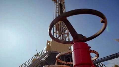 Drilling rig in operation, drilling a well, ukraine flag Stock Footage 142494775