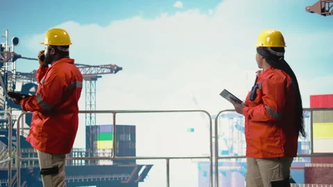 Drilling rig technicians track oil production efficiency, coordinating checkup Stock Footage 319975994