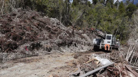 Drilling rig tracking up hill preparing seismic testing for oil. Stock Footage 22969457