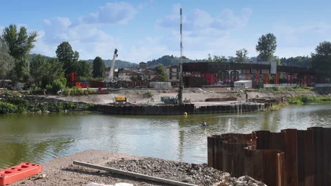Drilling rigs in action for the construction of the new tram bridge. Florence Stock Footage 316252128