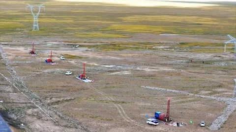 Drilling Rigs and Power Lines in Vast High-Altitude Landscape Tibet China Stock Footage 346570892