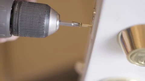 Drilling in a screw with an electric drill Stock Footage 148308326