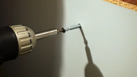 Drilling a screw into a flatpack cupboard 動画素材 122206005