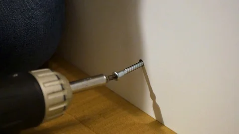 Drilling a screw into a flatpack cupboard 動画素材 122206237