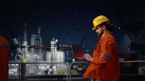 Drilling ship men using laptop to monitor defects during war causing oil crisis Stock Footage 336198088