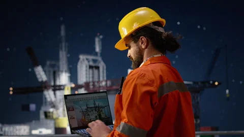 Drilling ship men using laptop to monitor defects during war causing oil crisis Stock Footage 336201336