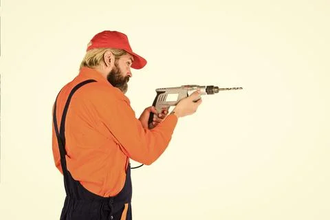 For drilling solid wall you need masonry bit. Man in cap with drills white Foto stock