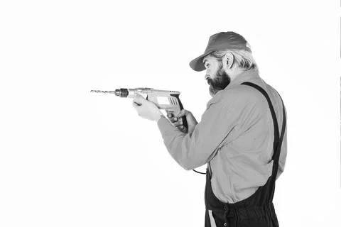 For drilling solid wall you need masonry bit. Man in cap with drills white Foto stock