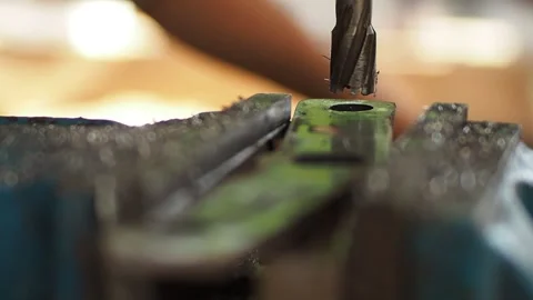 Drilling steel, Drilling Machine processes the metal, cut out the shape. Per Stock Footage 136867914