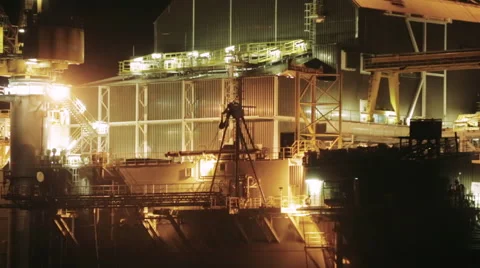 Drilling system on sea oil platform at night Stock Footage 68635820