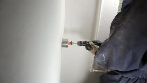 Drilling the wall with a diamond drill. Stock Footage 263761687