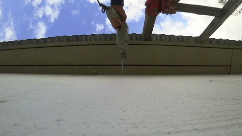 Drilling a wall. A man with a tool makes a hole in the wall. 스톡 동영상 94197573