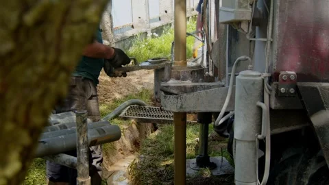 Drilling a water well at a construction site in rural area Video stock 336792539