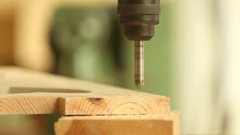 Drilling wood with a drill machine in the carpentry Stock Footage 116995180