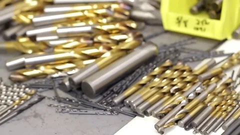 Drills and drill bits on a table Stock Footage 77630898
