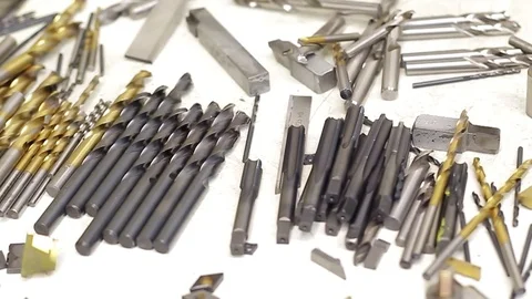 Drills and drill bits on a table Stock Footage 77630904