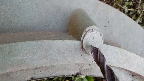 Drills a hole with a large drill, close-up. Stock Footage 115494508