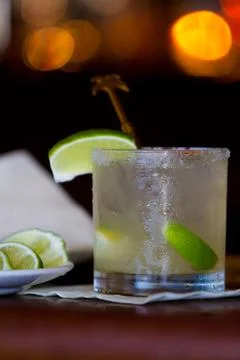 Drink and limes on bar and bokeh 2 Stock Photos