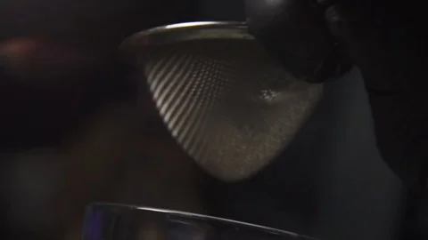 Drink being filtered through funnel Stock Footage 90123134