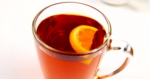 Drink black tea in a transparent cup and teapot Stock Footage 143121992