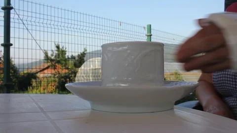 Drink coffee with an arm in a cast Stock Footage 252233934