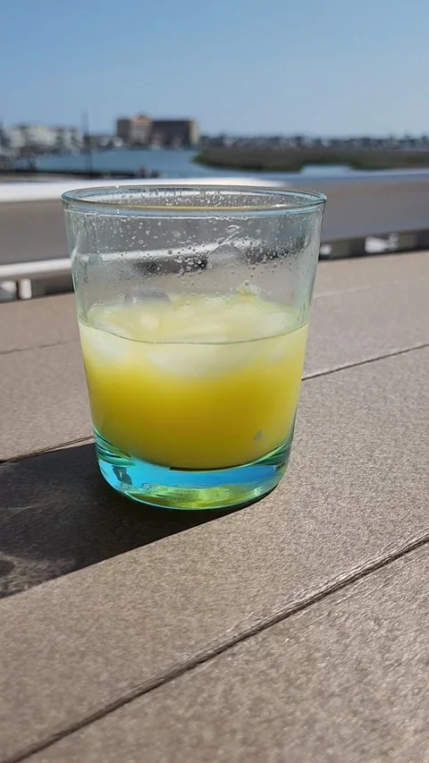 A Drink On A Deck Over Water Vidéo 243062284