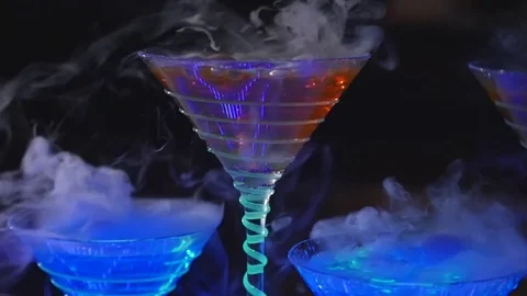 Drink in glass with the effect of dry ice. barman show Stock Footage