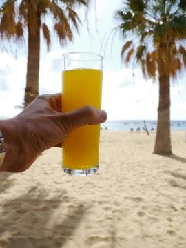 Drink hand beach Stock Photos