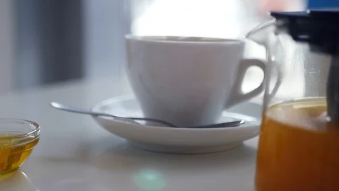 Drink invigorating hot tea in a white cup with steam. slow motion, 1920x1080 Stock Footage 97505214
