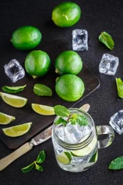 Drink with lime, mint and ice Stock Photos