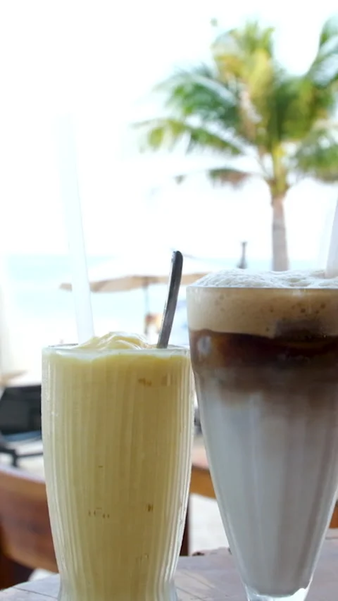 Drink mango smoothie Ice latte serene moment enjoying fries and drinks with a Stock Footage 306642297