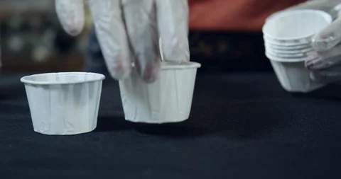 Drink samples for customers at grocery store in small paper cup Video stock 118847072
