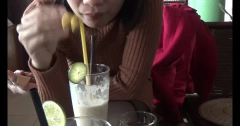 Drink smoothie in the shop Stock Footage 293268634