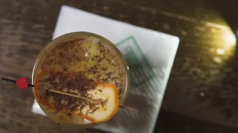 Drink spinning on bar table Stock Footage 90123158