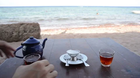 Drink Tea at the Beach Stock Footage 61939957