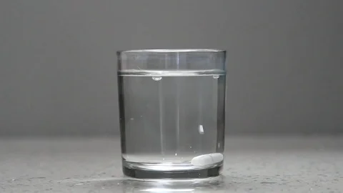 Drink water with a pill Video stock 77460633