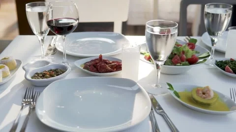 Drinking alcohol white table salad ice cubes avocado olive water Stock Footage 204103357