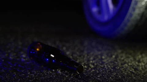 Drinking and Driving - Beer Bottle and Car Tire Abstract Concept Stock-Footage 61764403