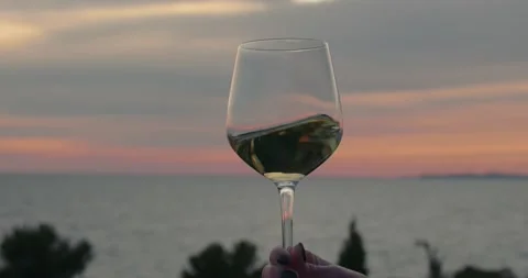 Drinking and tasting wine in sunset at sea Stock Footage 153534343