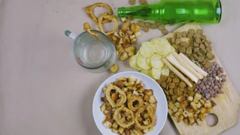 Drinking beer. Table full of beer snacks Stock Footage 132290546